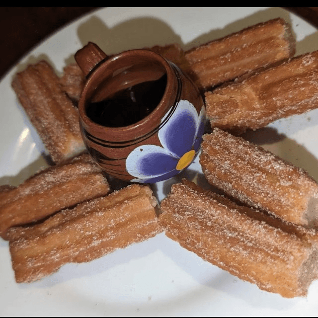 Churros with chocolate sauce.