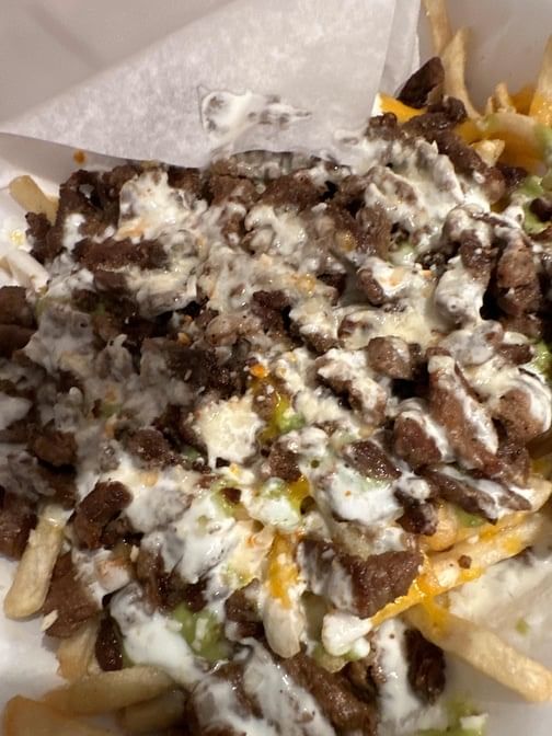 CARNE ASADA FRIES - CHEESE, CARNE ASADA, GUACAMOLE, SOUR CREAM, QUESO.