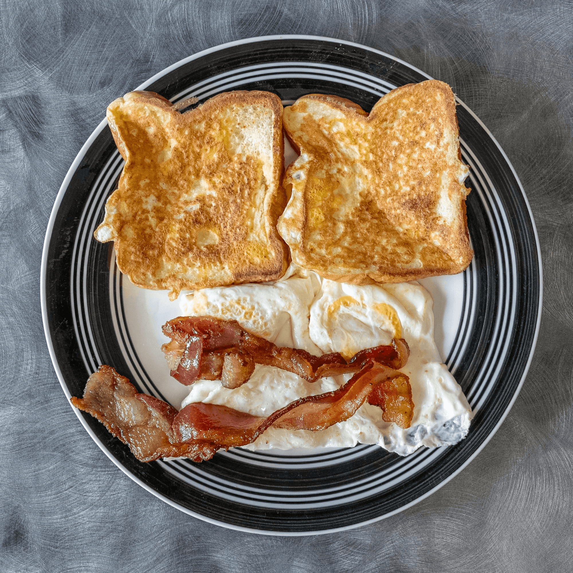 Two Eggs, Two Pancakes, Meat, Side, and Bread.