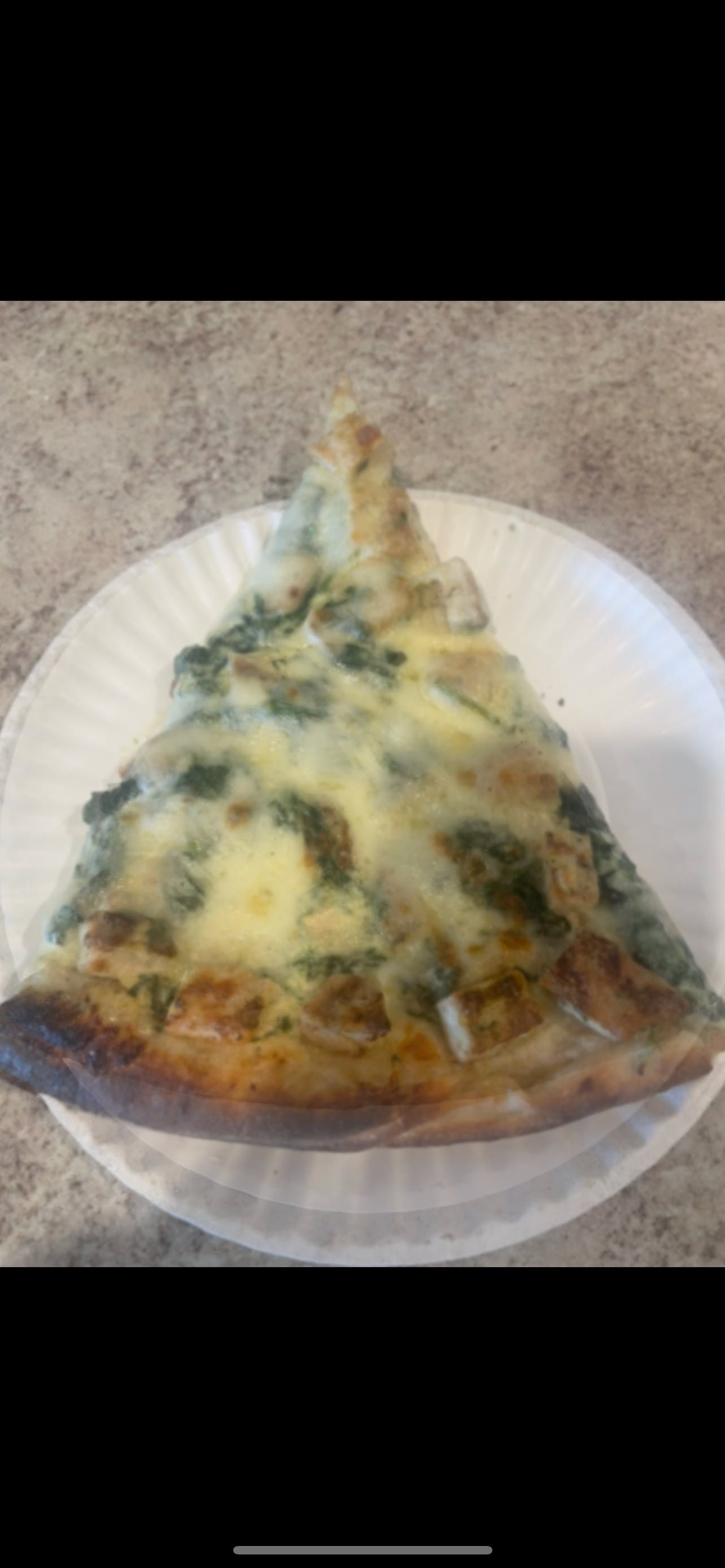 Chicken Spinach Alfredo Pizza Slice.