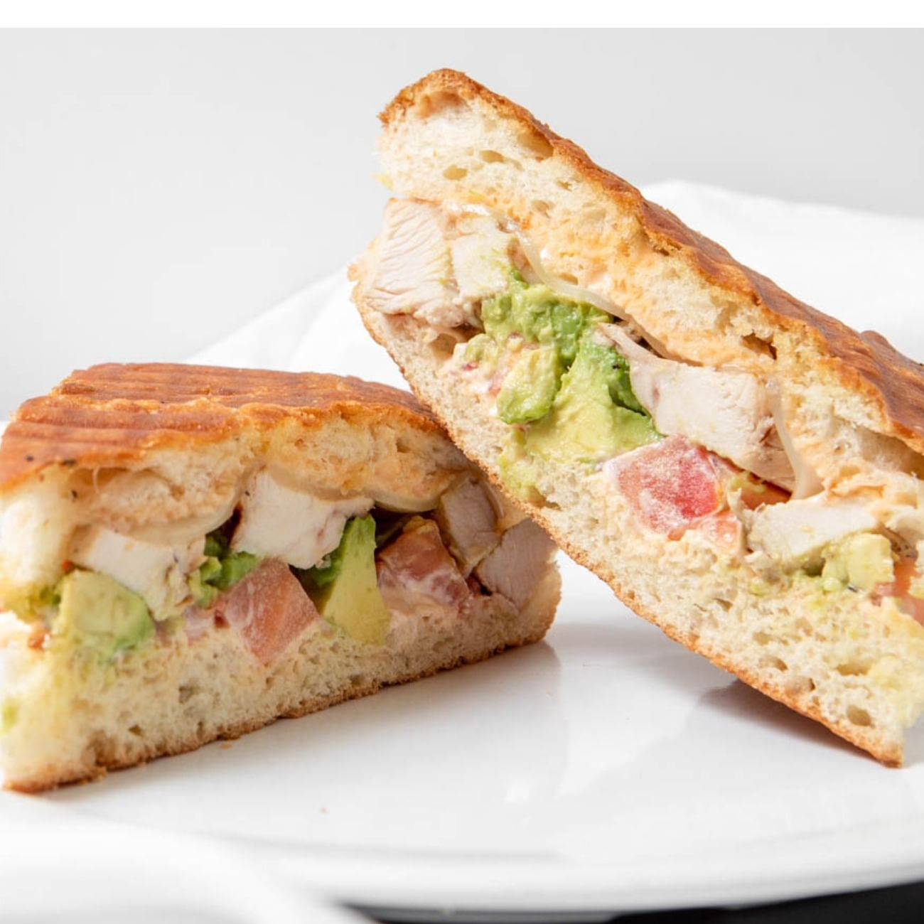 Grilled Chicken & Avocado Panini Sandwich.