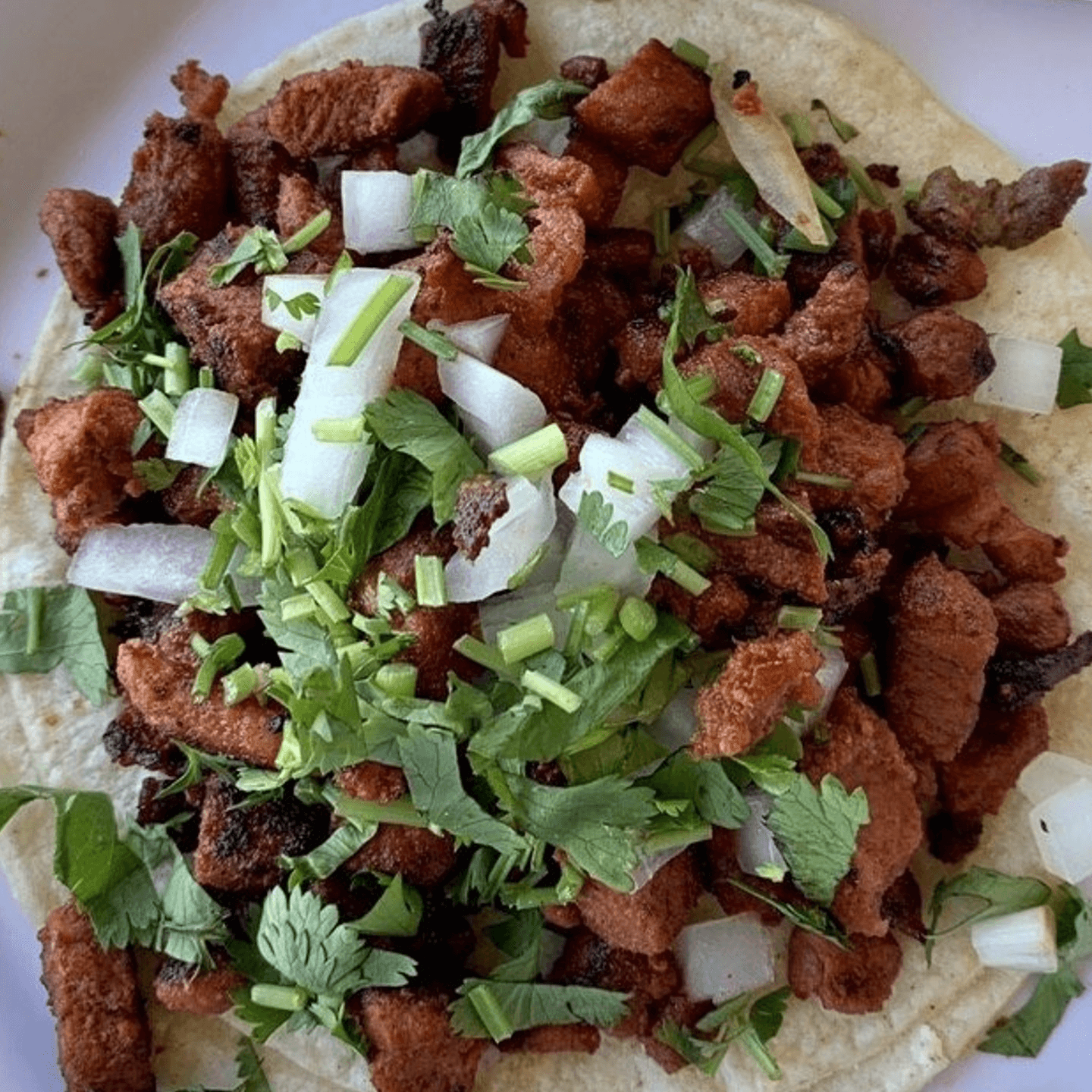 What sets our Tacos Al Pastor apart? 