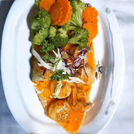 Jumbo Prawn Tempura Glazed with Sweet Chili Reduction Sauce.