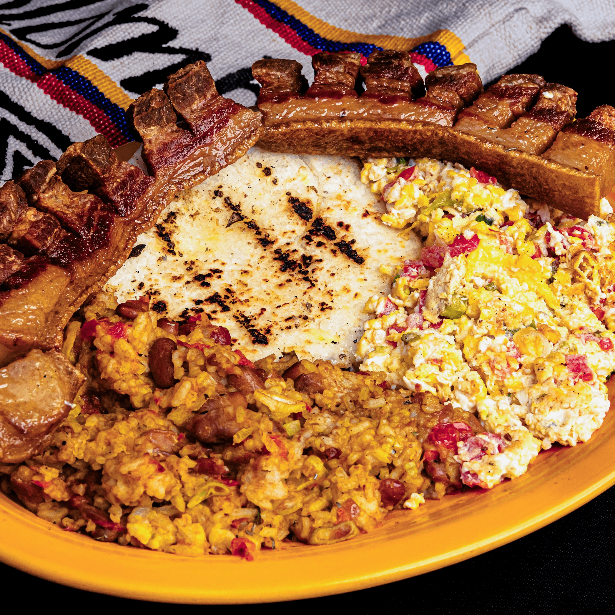 Calentado, Huevos, Chicharron Y Arepa.