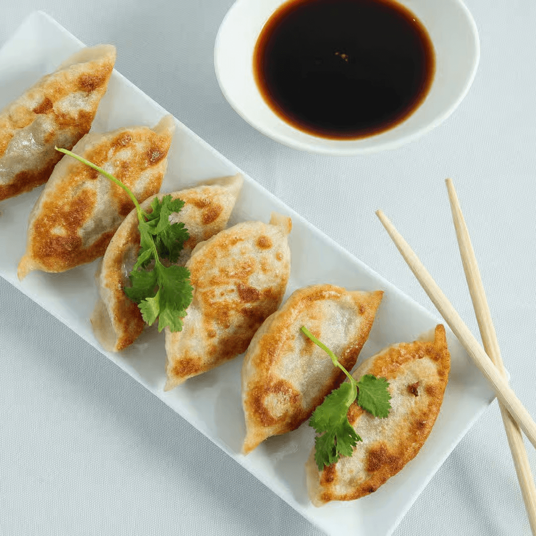 生煎锅贴 Pan Fried Pork Dumplings.