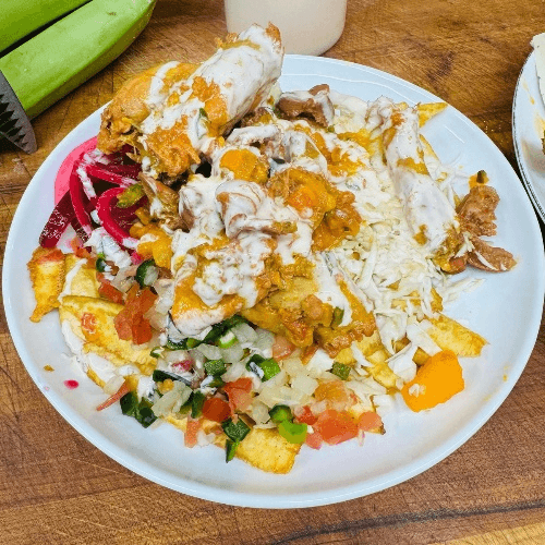 Menudo con Tajadas/Chicken Giblets with sliced green bananas.