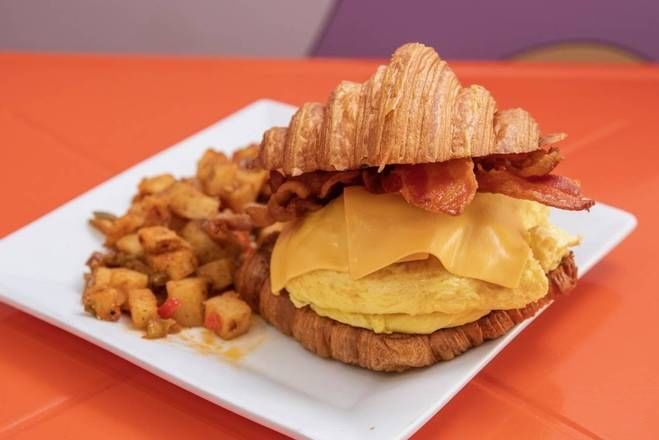 PROMO CROISSANT SANDWICH WITH HOME FRIES.