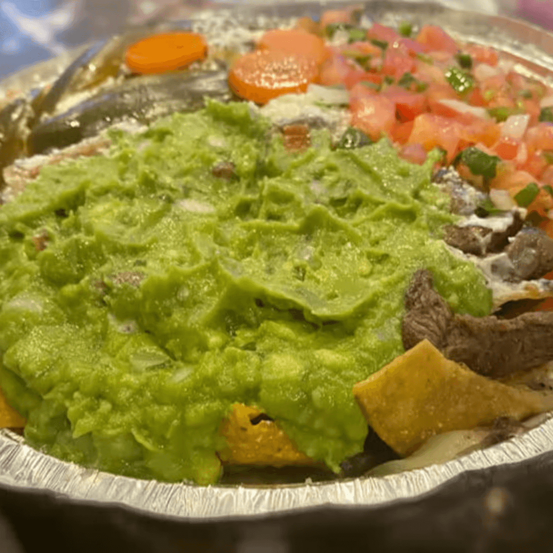 71. Nachos Con Bistec.