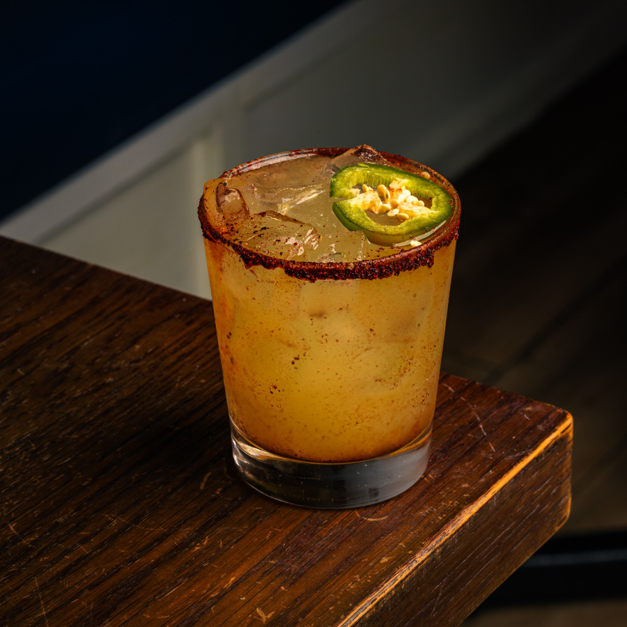 Spicy cocktail with a chili rim and jalapeno