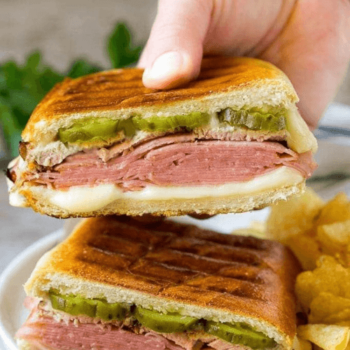 Cuban Sandwich (Roast Pork, Ham, Swiss Cheese, Pickles & Mustard).