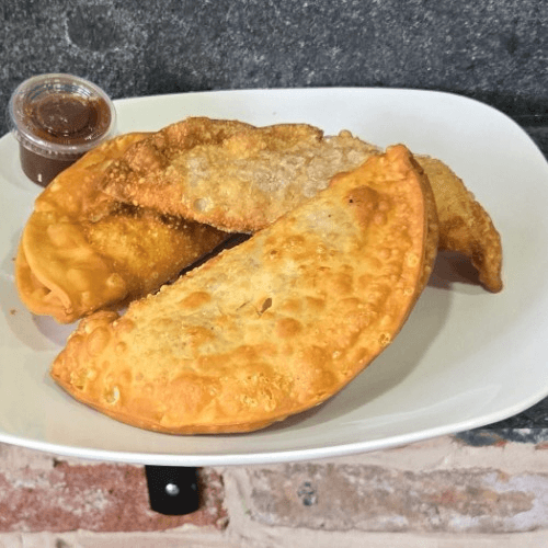 Buy 2 jerk chicken empanadas and get a 3rd for free!.