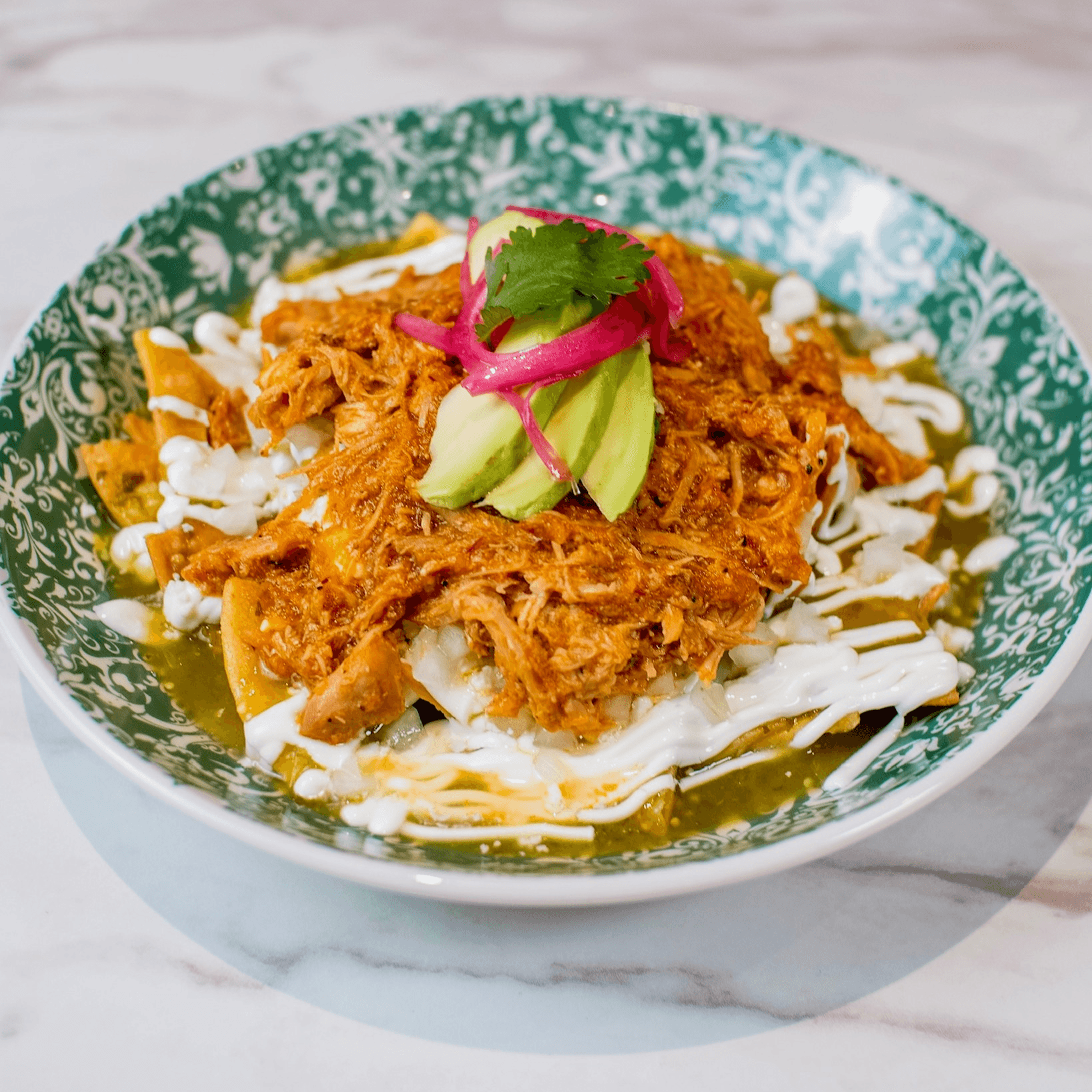 Spicy chicken tinga chilaquiles.