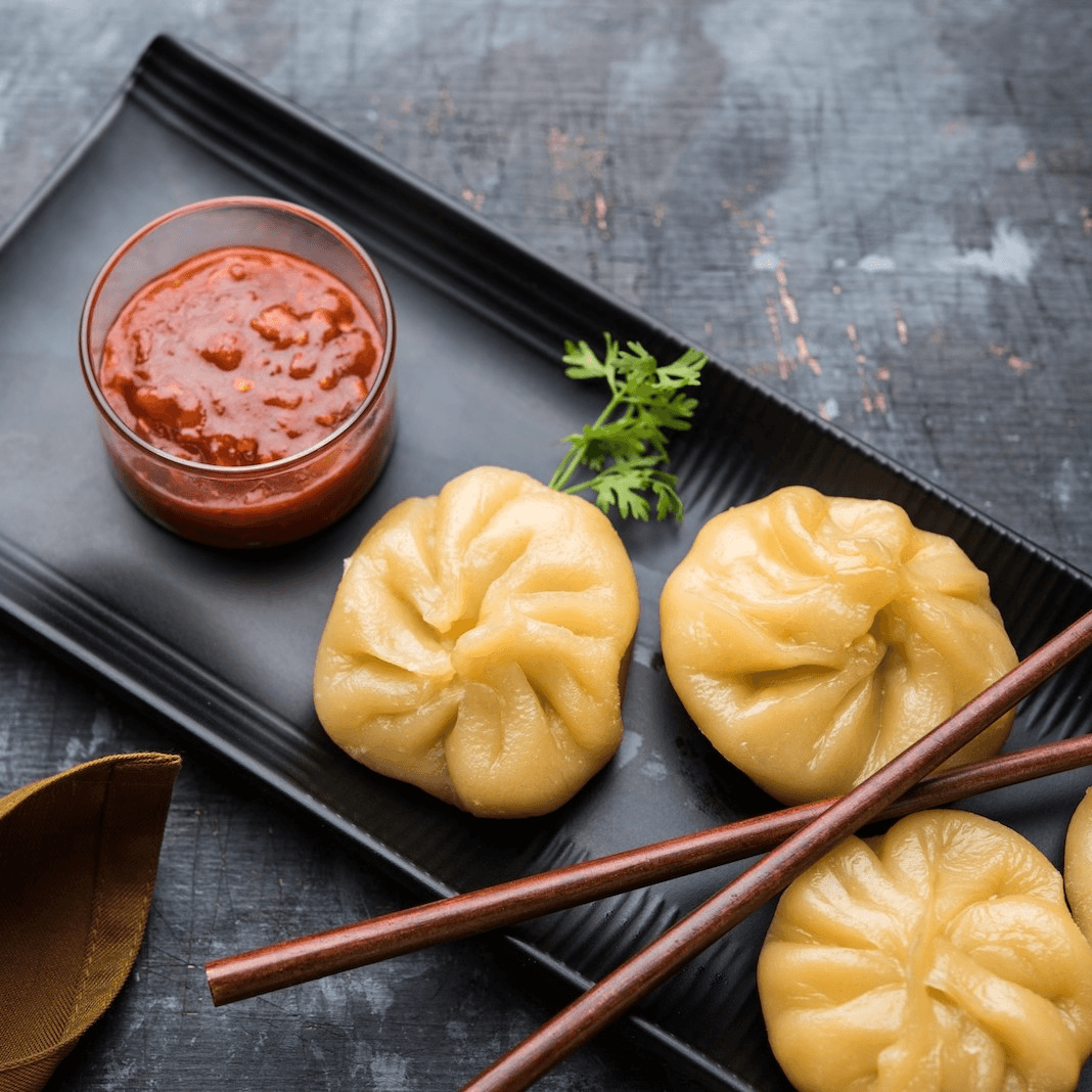 Chicken Dumpling in Hot Sesame Sauce (8 Pcs).