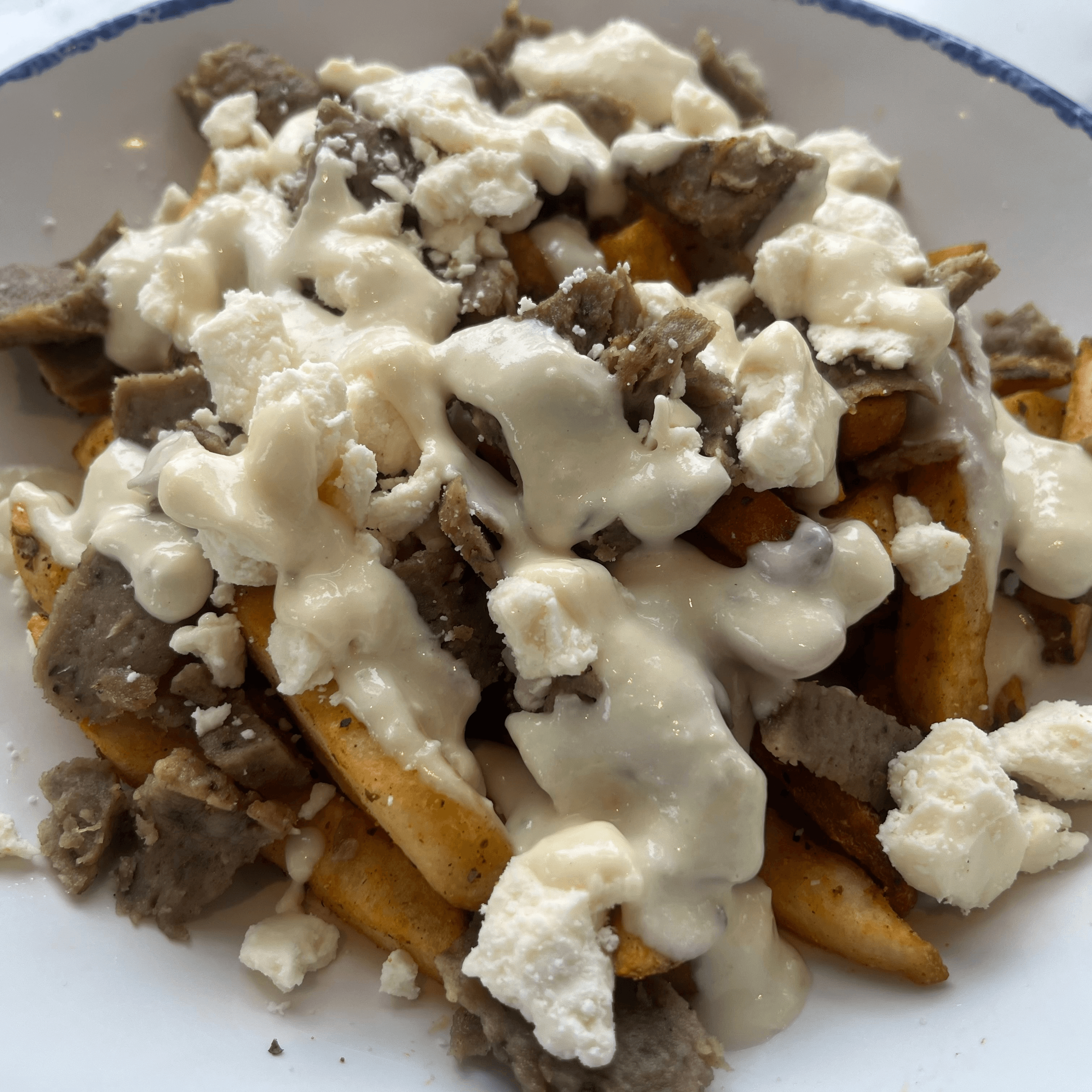 Taza Greek Style Poutine.