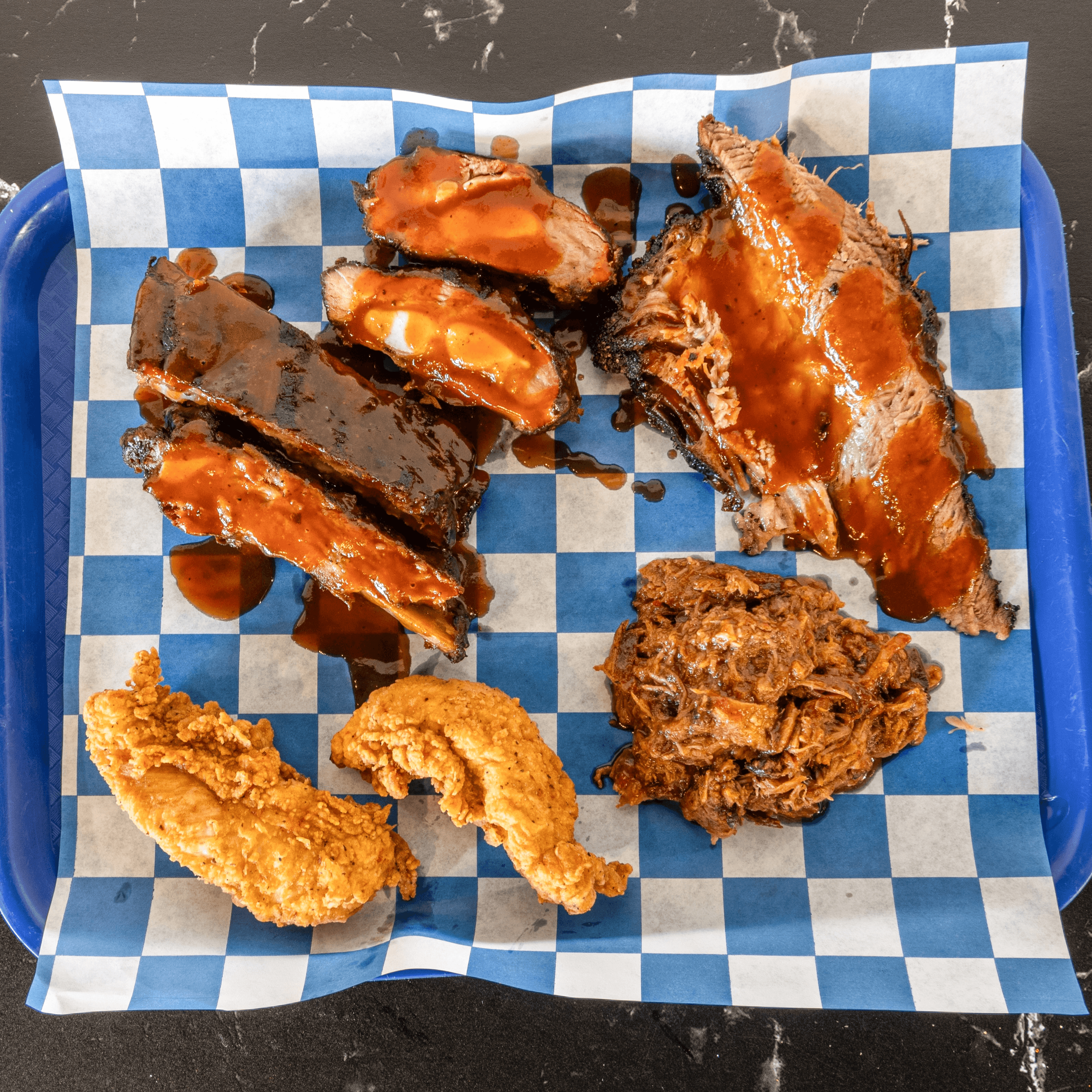 Sampler - 2 ribs/sliced brisket/pulled pork/2 rib tips/2 fried tenders.
