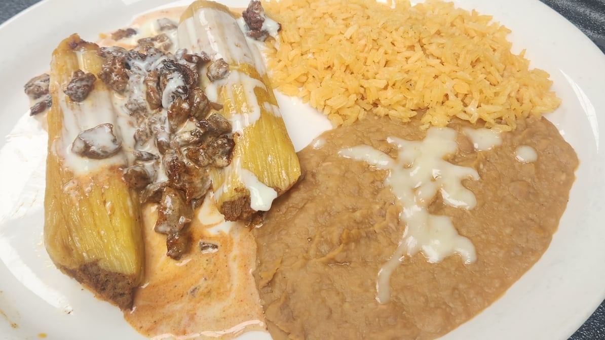 I. 2 Tamales with Chile Con Carne.