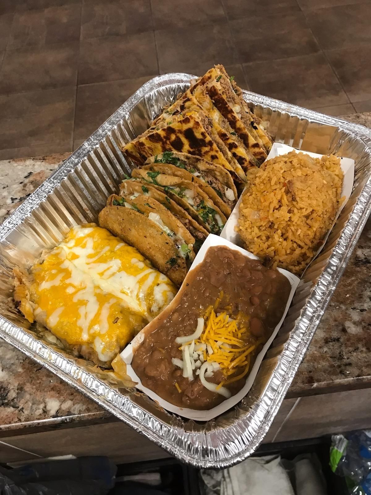 The Sampler - 2 Tacos, 2 Quesadillas , 2 Enchiladas with Sides.