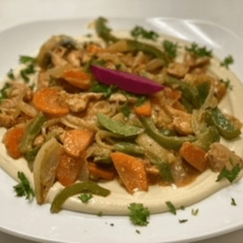 Hummus Topped with Chicken Shawarma Lunch.