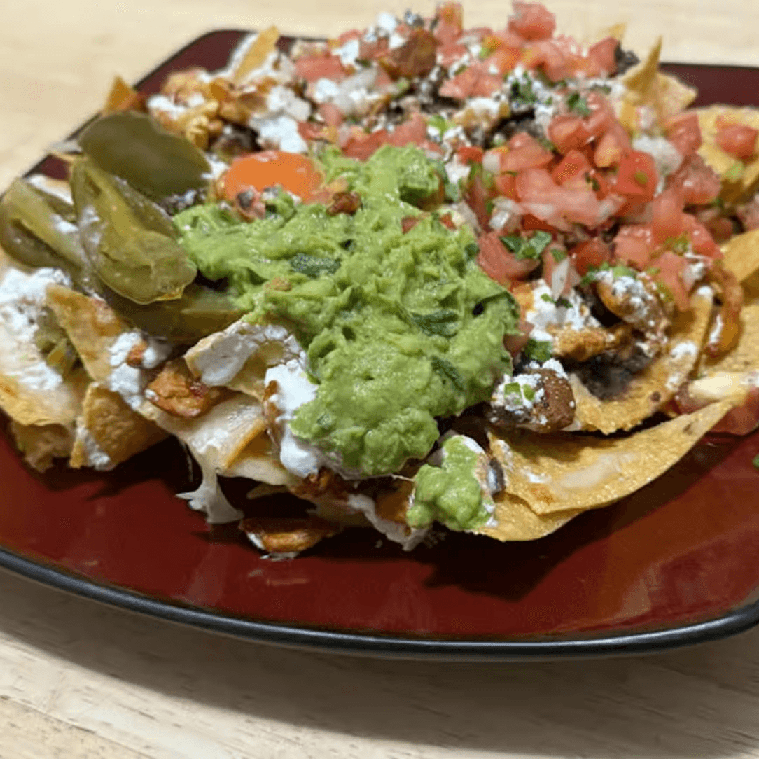 70. Nachos Con Pollo.