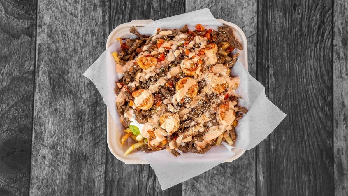 SURF & TURF FRIES - CHEESE, ASADA, SHRIMP ,GUAC, SOUR CREAM, QUESO.