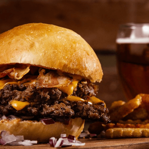 8 Oz Beef Burger Topped with Melted Cheese.