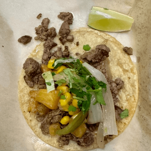 Taco Mamalon- Grilled veggies, including corn, pineapple, bell peppers, caramelized onions, fresh onions and cilantro..