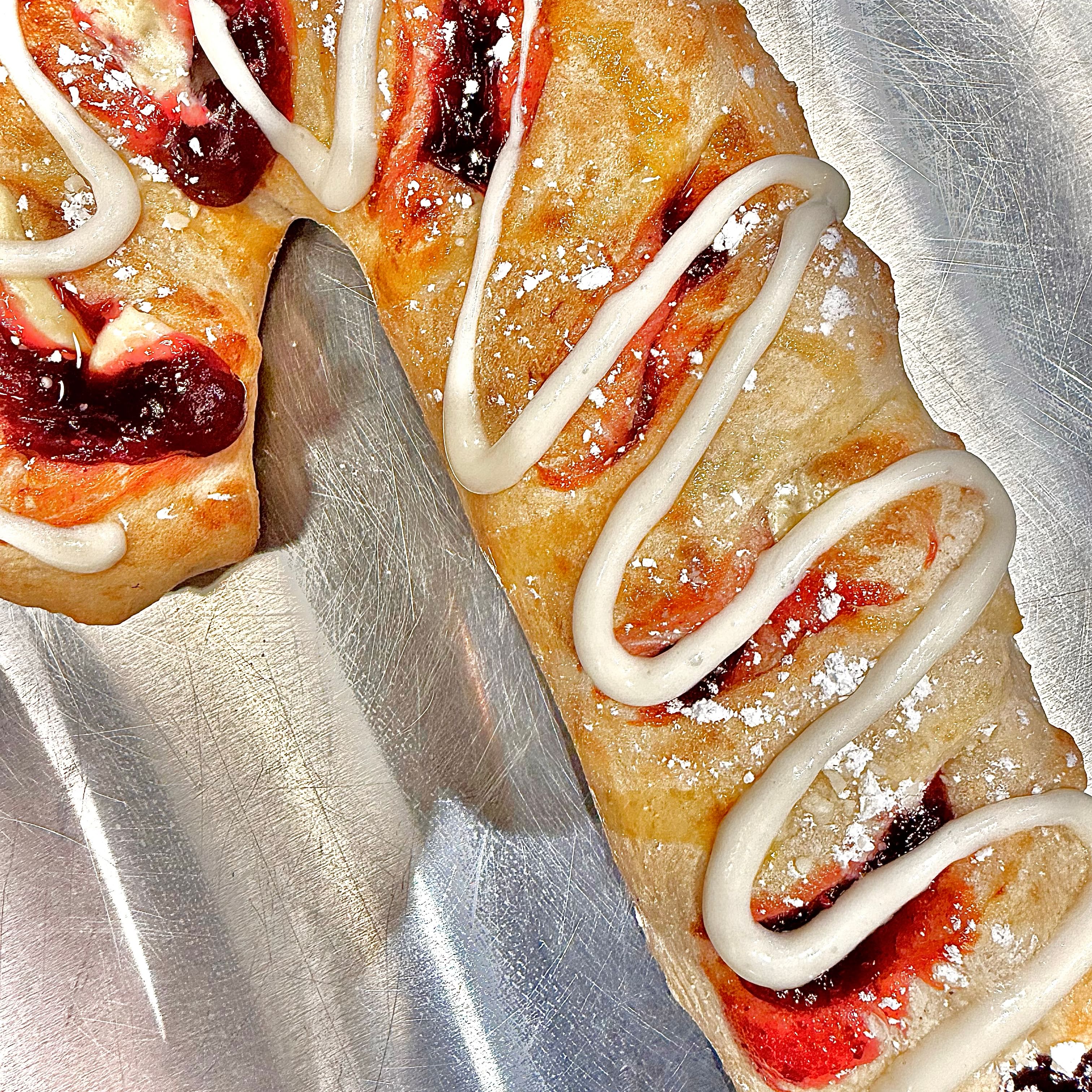Raspberry Stuffed Cane with Frosting Drizzle.