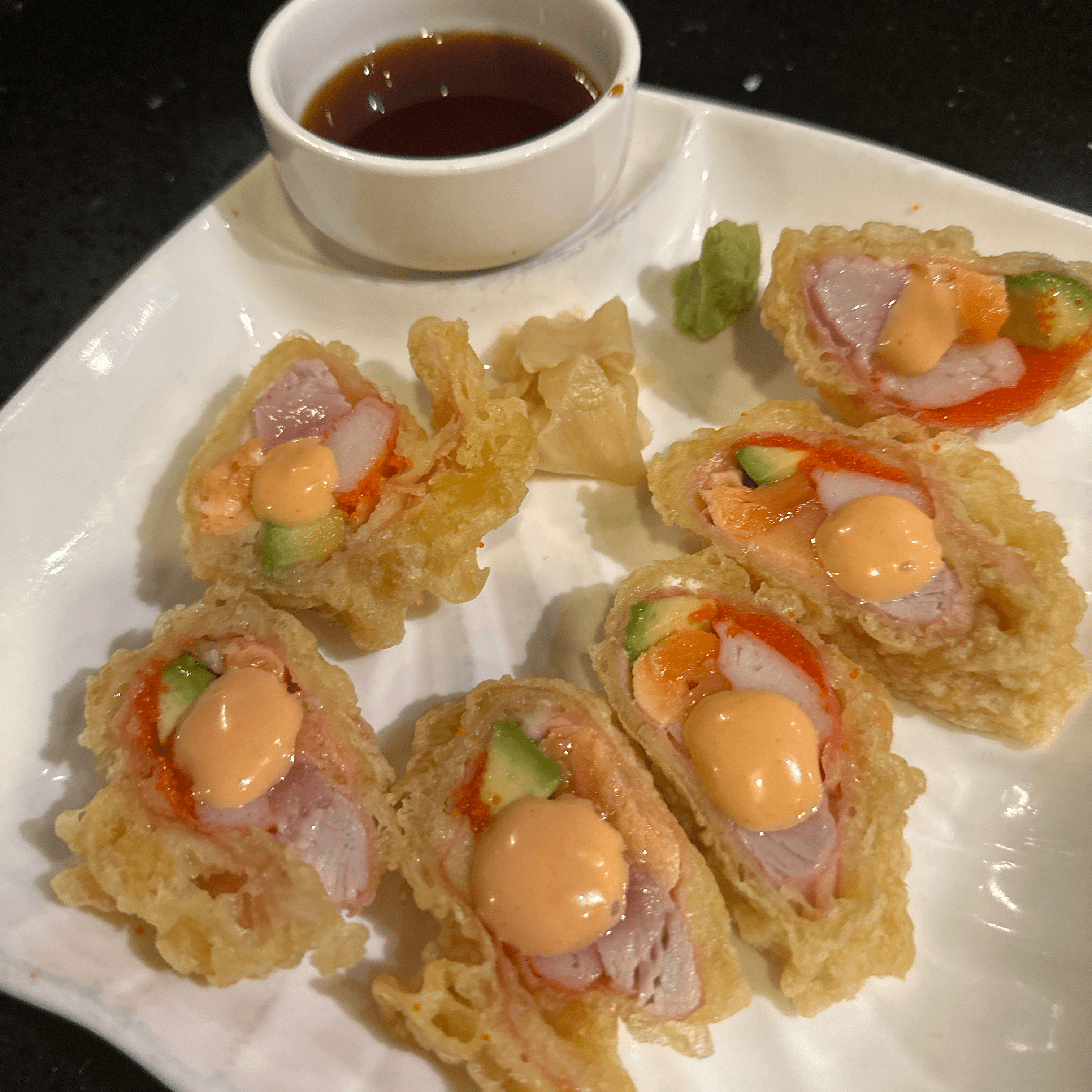 Bird of Paradise - Tuna, salmon, avocado, crab stick and masago rolle…hen lightly tempura fried. Served in ponzu sauce..