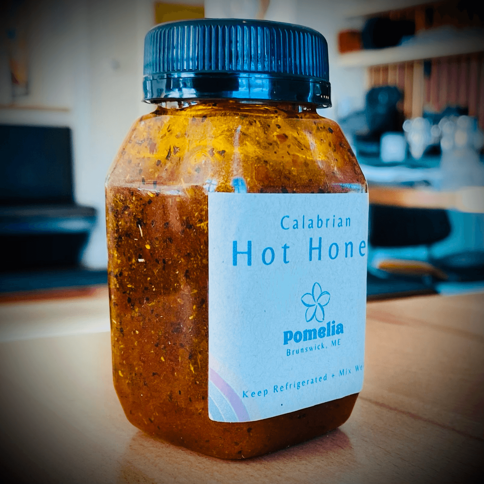 Bottle of Pomelia Calabrian Hot Honey.