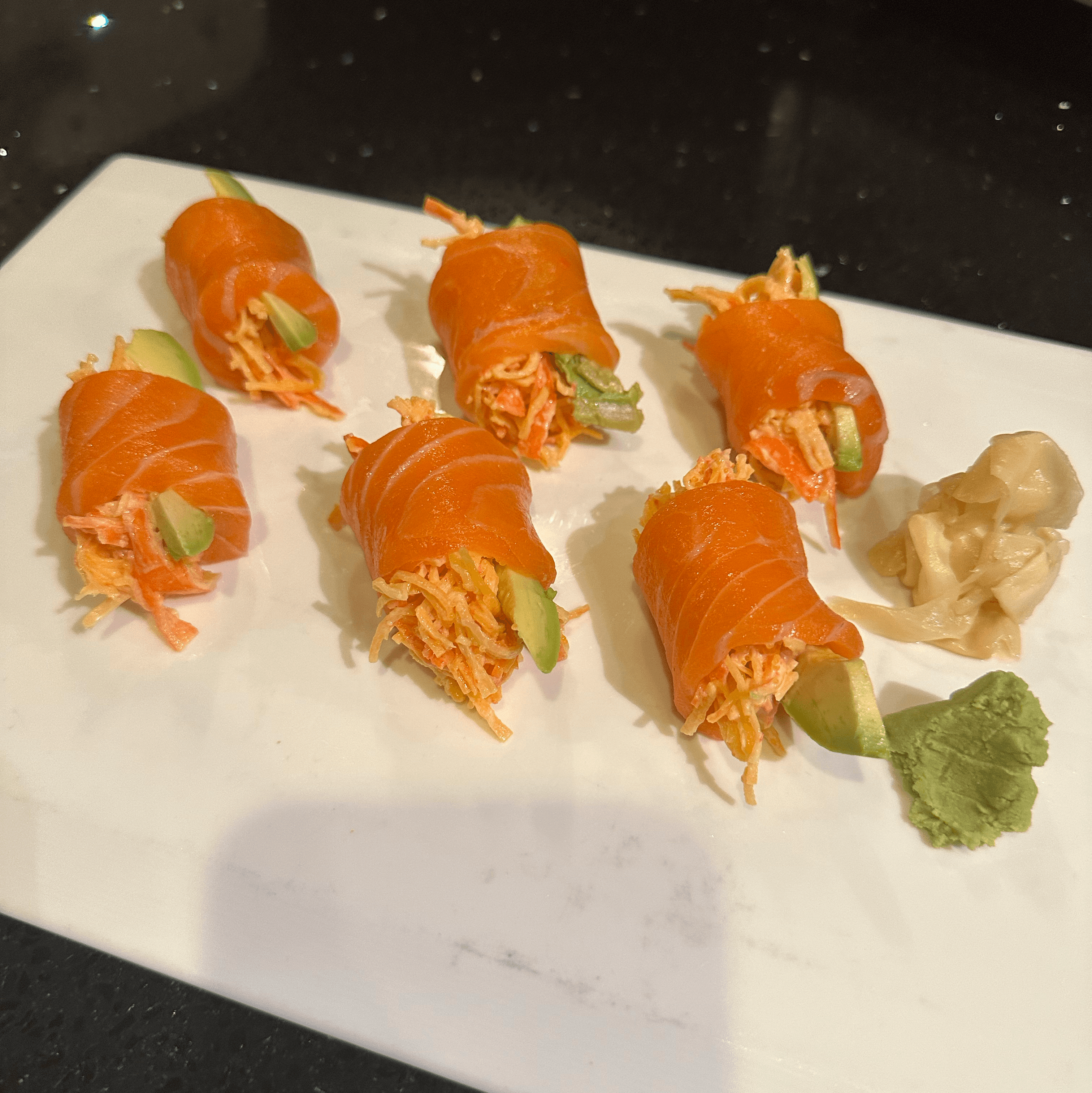 Devil Roll - Special crabs salad and avocado rolled with fresh salmon.