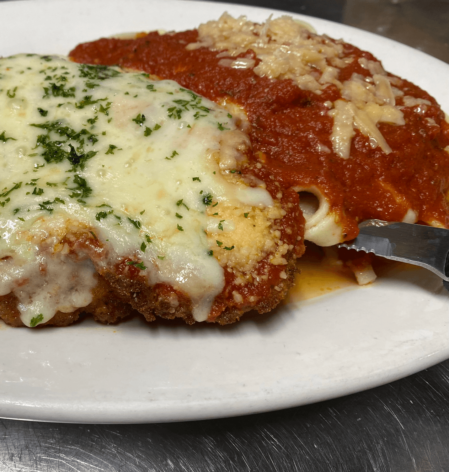 Chicken or Veal Parmigiana.