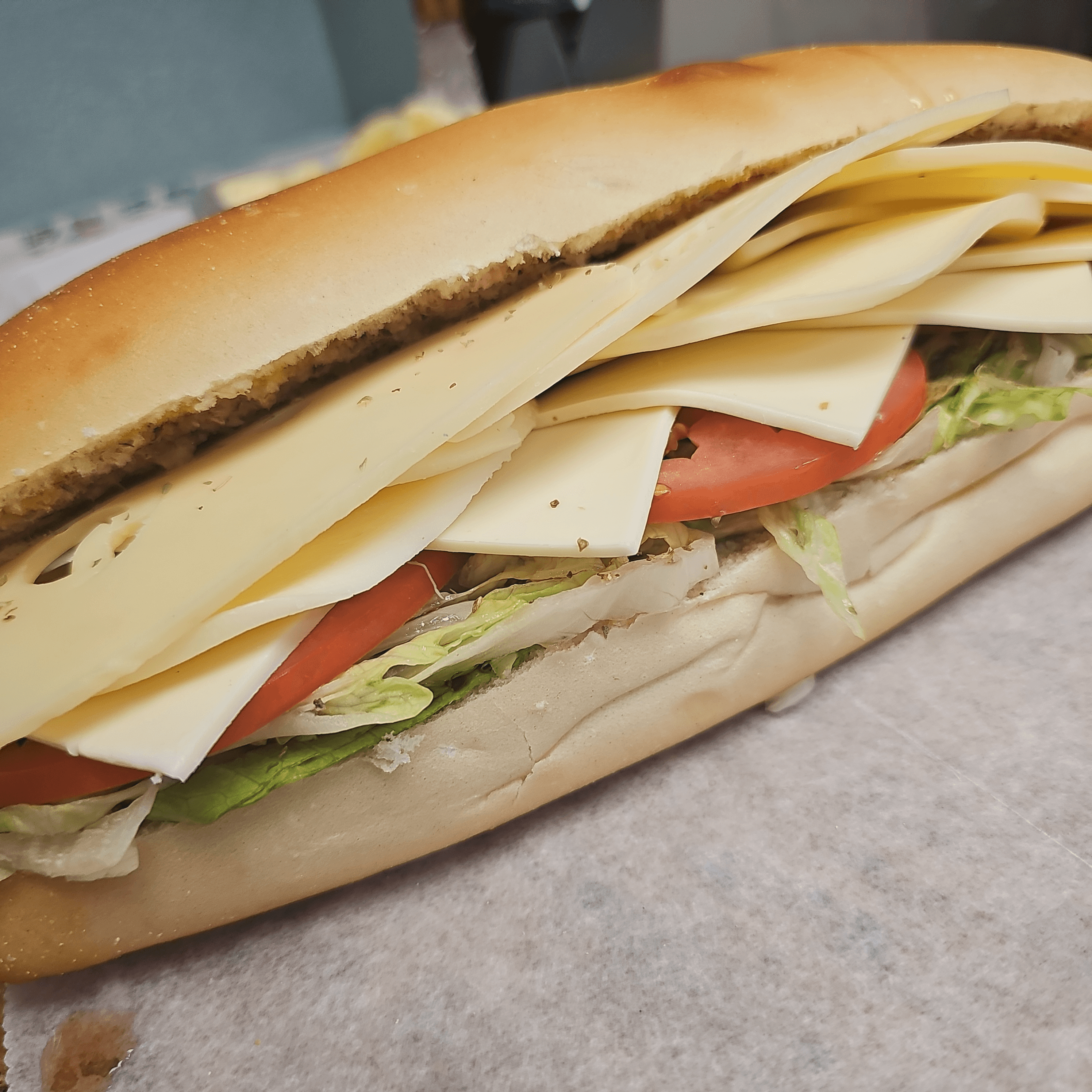 #30 Provolone Cheese, Swiss Cheese, American Cheese Sandwich.