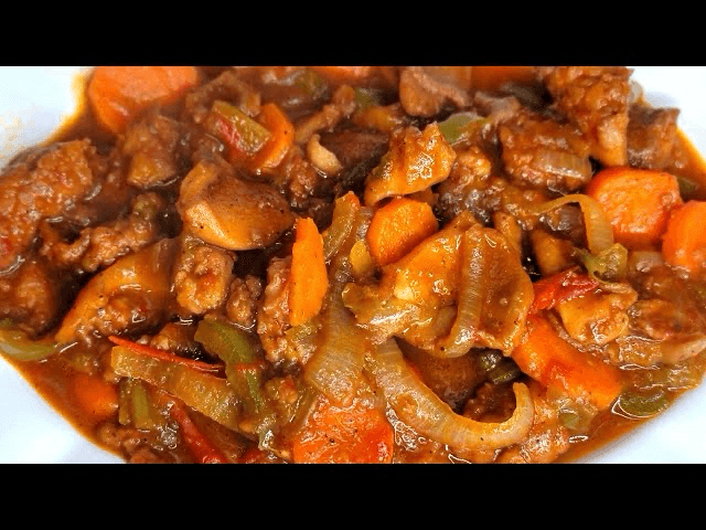 Side: Haitian Lambi (Conch Stew).