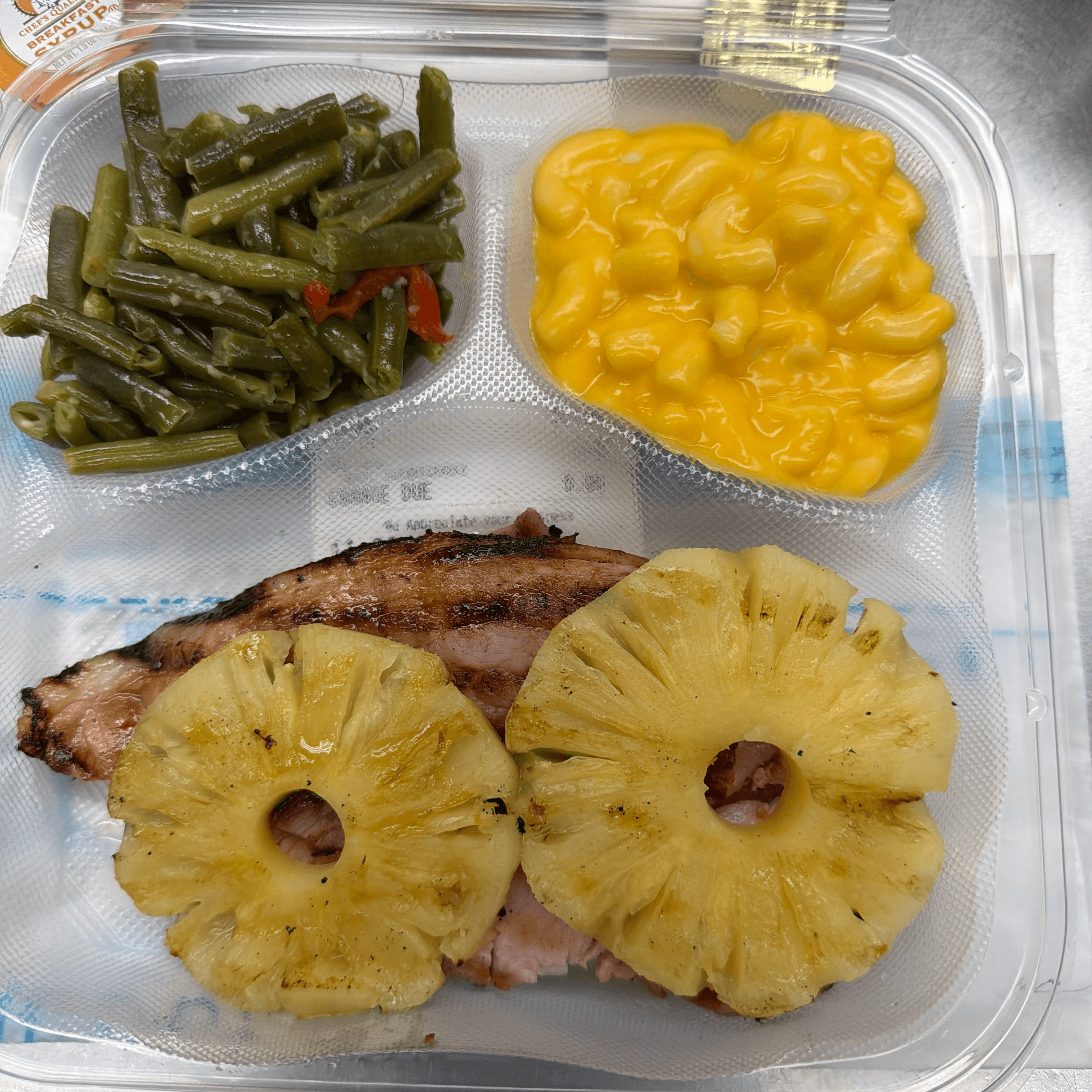 Honey Baked Ham with Sliced Pineapple Ring.