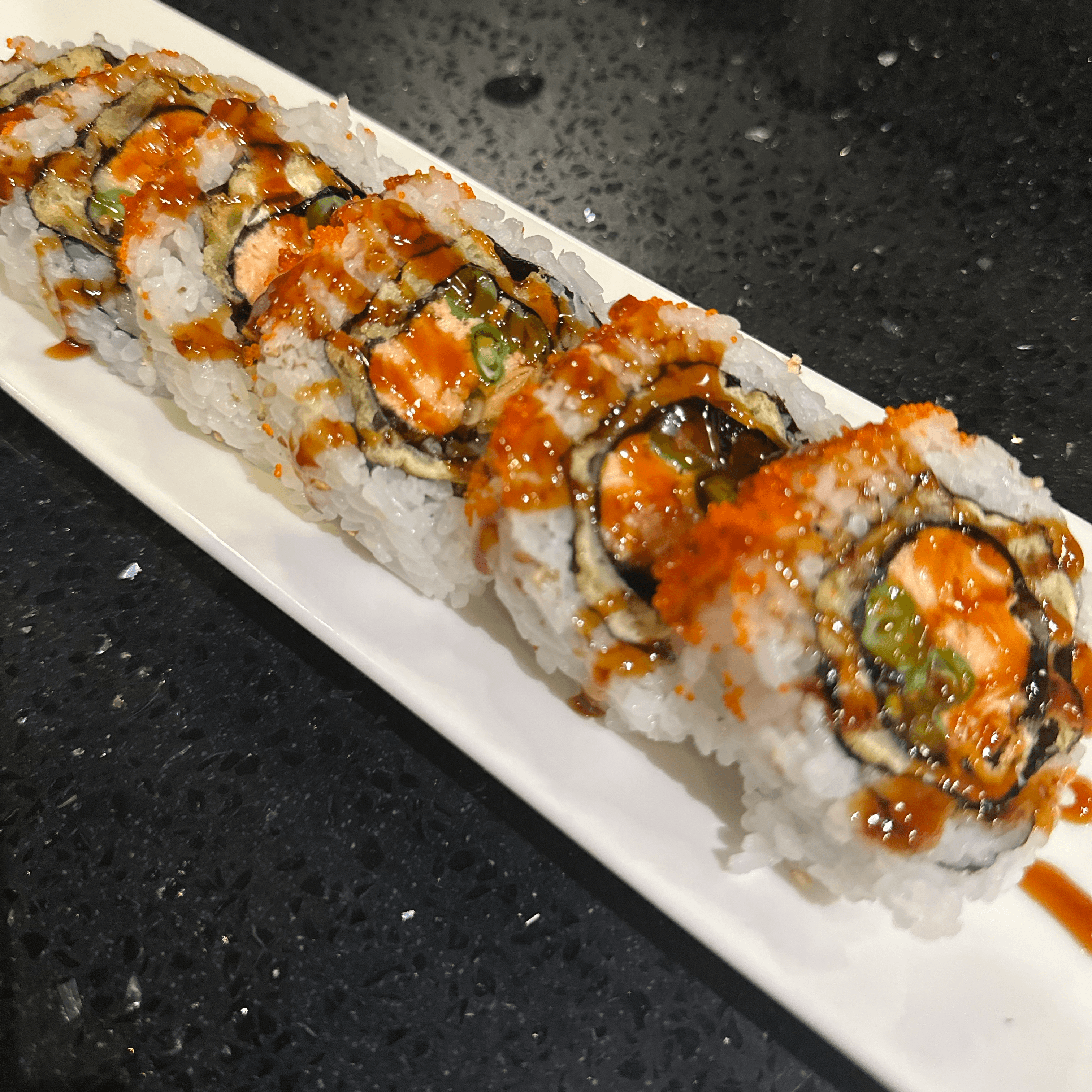 Tiger Eye Roll, Green bean, cooked salmon, fish egg on top.