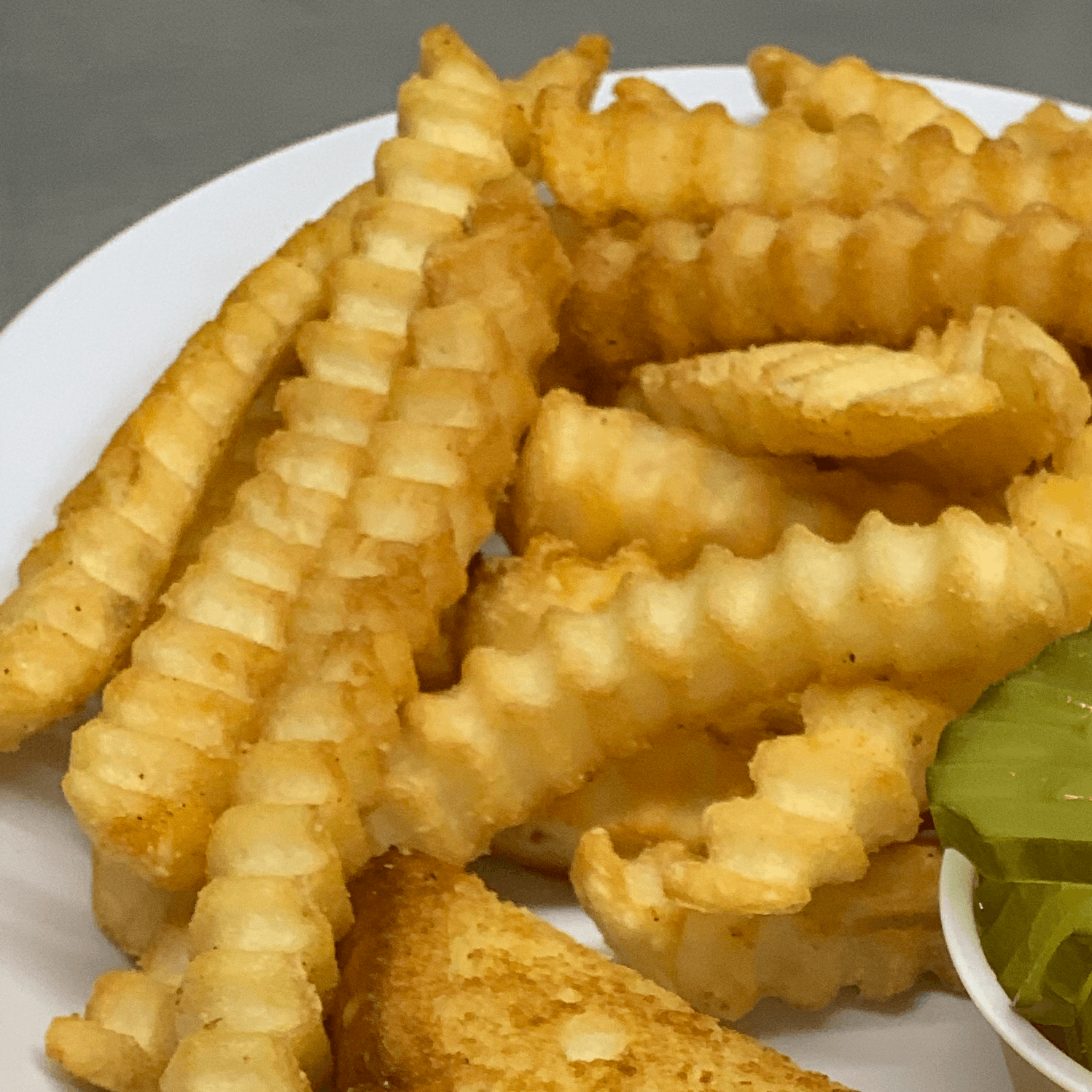 Crinkle Cut Fries with Seasoning Salt.