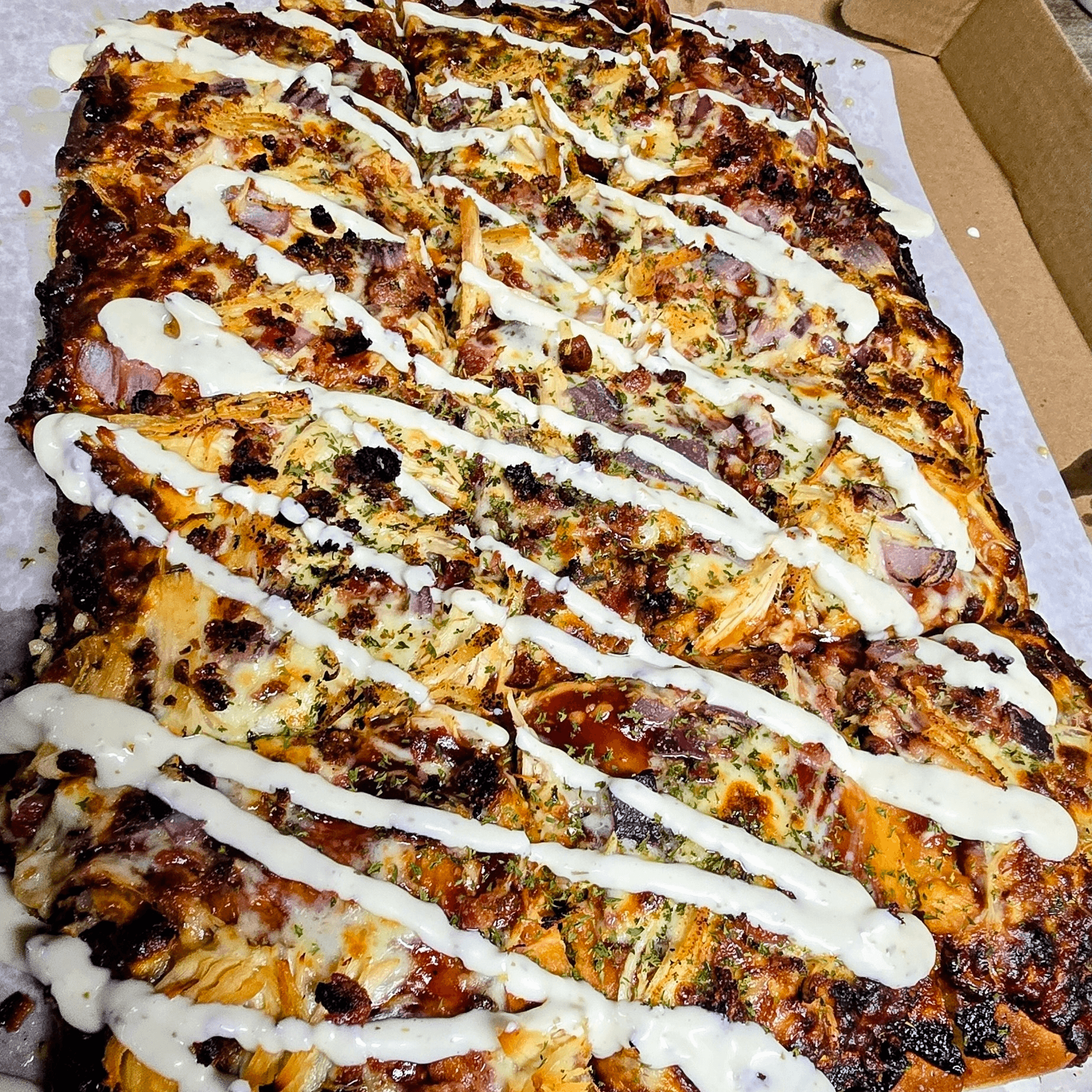 The Pig Hen BBQ Chicken, Bacon & Onion Pizza.