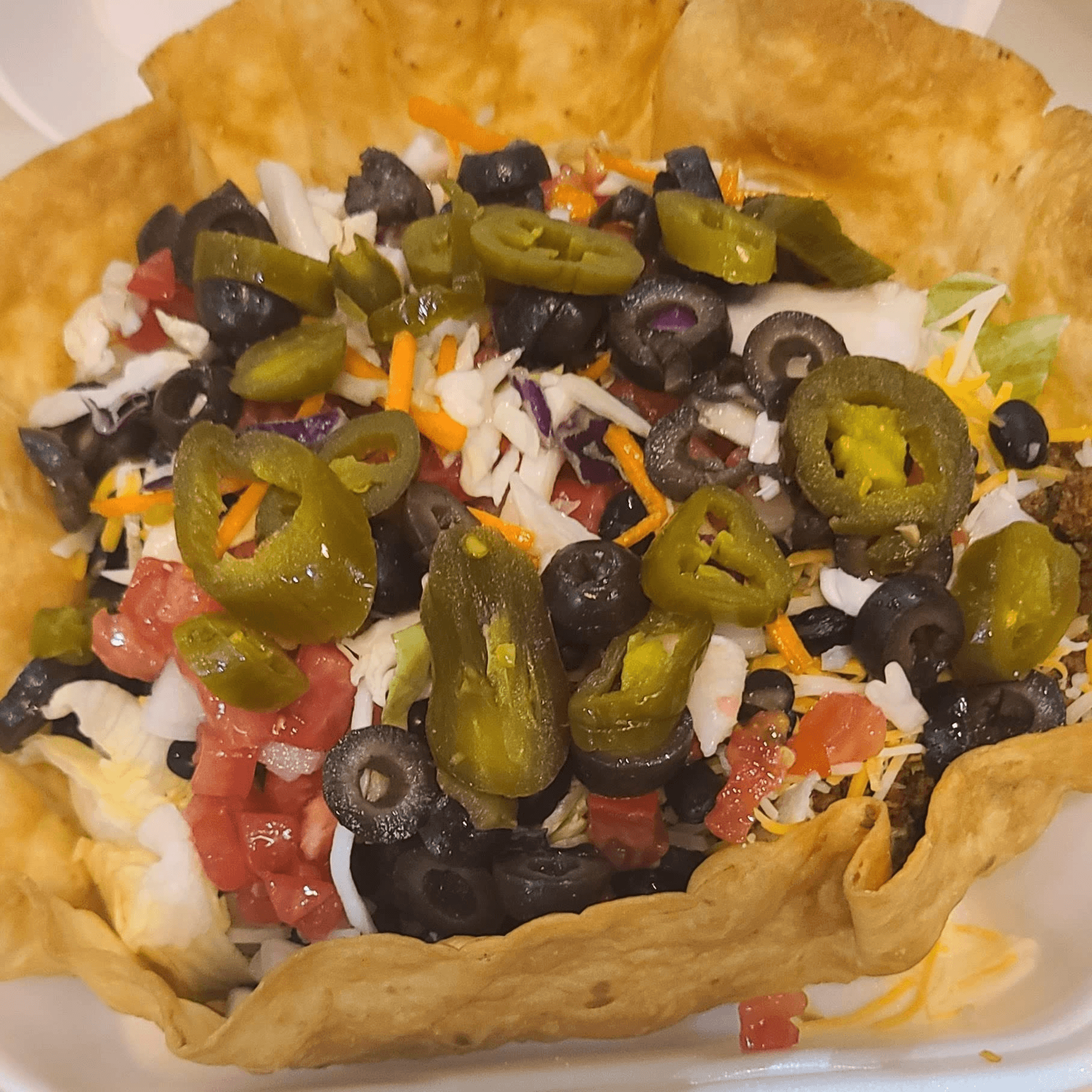 Buy 1 Taco Salad, Get 1 Half Off.