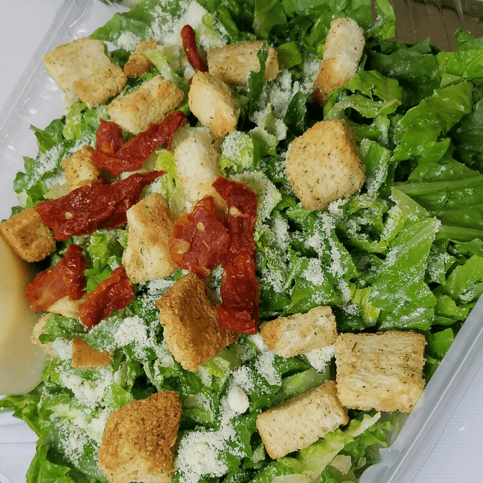 Caesar Salad Topped with Fried or Grilled Jumbo Shrimp