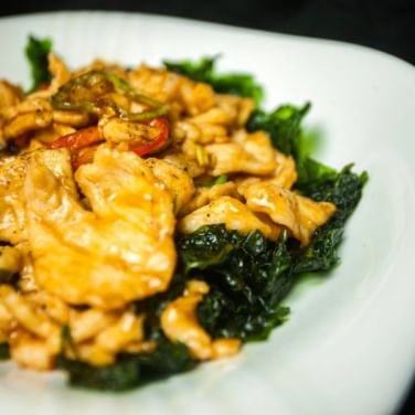 F12. Sautรฉed Sliced Chicken with Hot Pepper and Crispy Spinach.