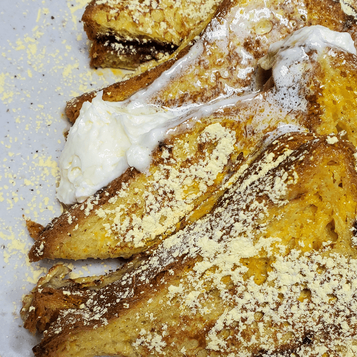 FRENCH TOAST TOPPED WITH POWDERED SUGAR