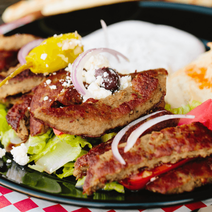 Greek Gyro Platter. (Pita Bread, Greek Salad, Tzatziki Sauce, & Choice of Side)