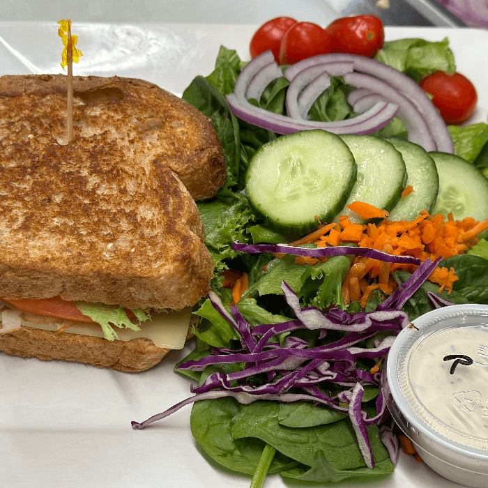 1/2 Sandwich & 1/2 Mixed Green Salad.