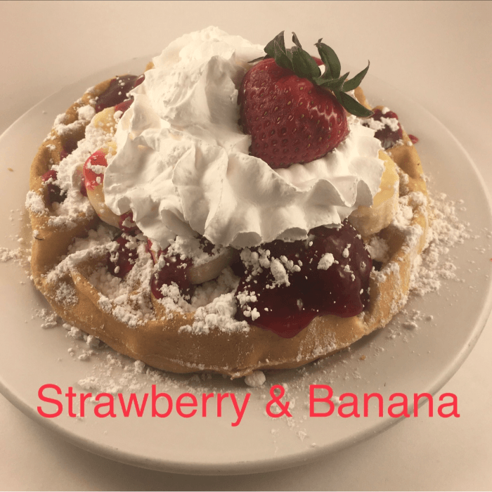 3 Strawberry Banana Pancake with Whipped Cream and Powdered Sugar