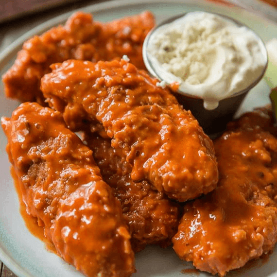 Buffalo Style Chicken Fingers Served with Blue Cheese 