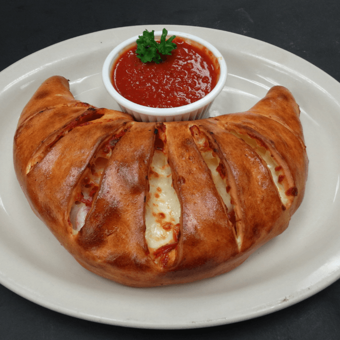 #6 One 2-Topping Calzone, One Sandwich of your Choice & 2 Cans of Soda